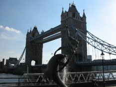 Girl with a Dolphin in front of Tower Bridge